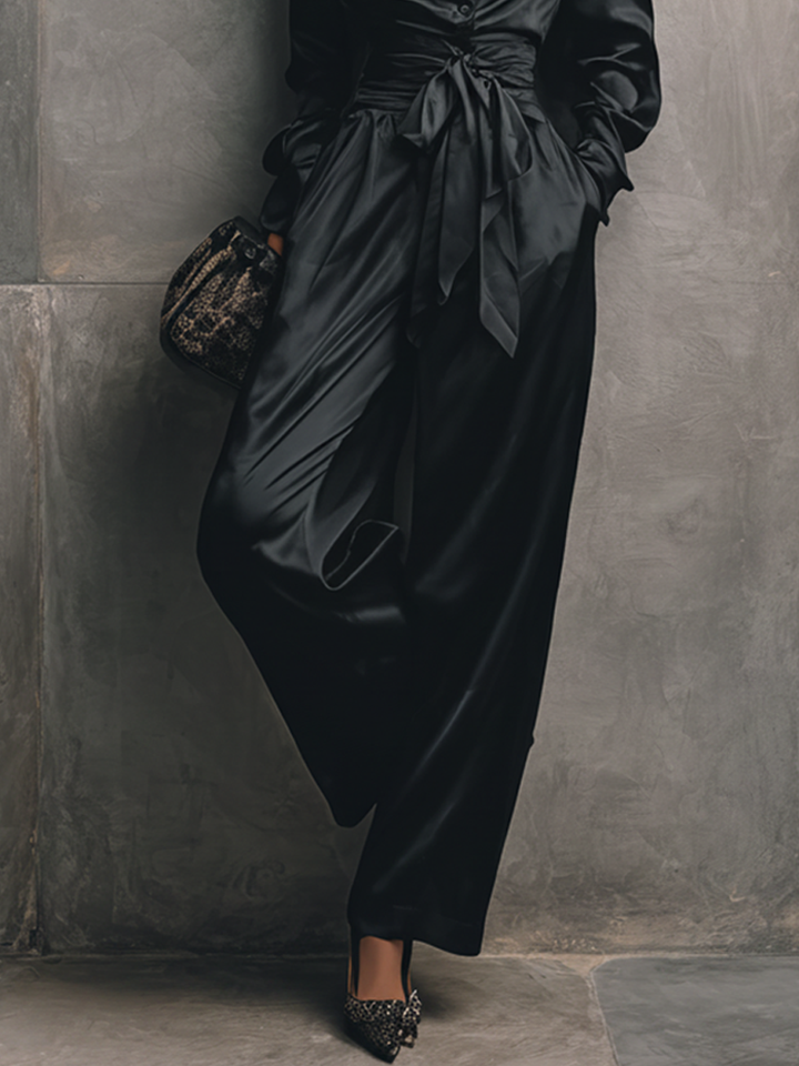 Women's Minimalist Black Satin V-Neck Fitted Waist Belted Wide-Leg Jumpsuit MDZ2017D7GMJ